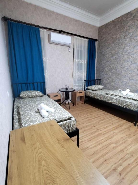 Postel nebo postele na pokoji v ubytování old kutaisi