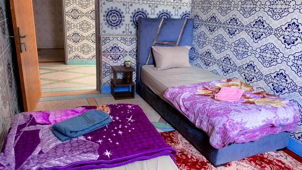 Postel nebo postele na pokoji v ubytování Tayrt Hostel