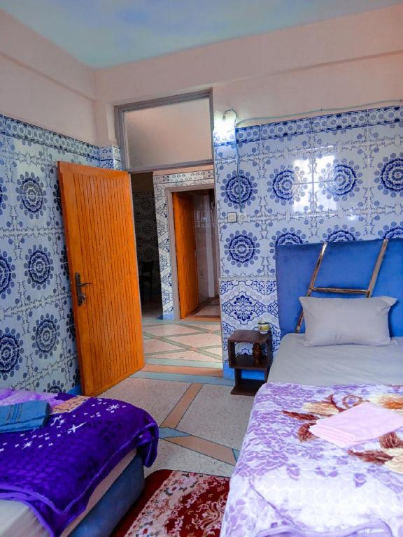 Postel nebo postele na pokoji v ubytování Tayrt Hostel