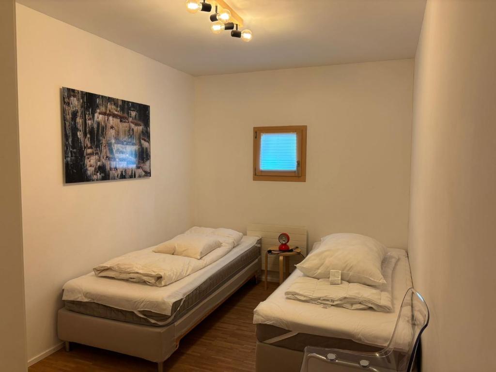 Postel nebo postele na pokoji v ubytování Chesa Rivarel - Pontresina