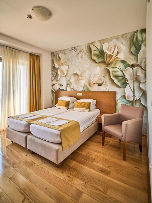 Postel nebo postele na pokoji v ubytování Hotel Petrovac