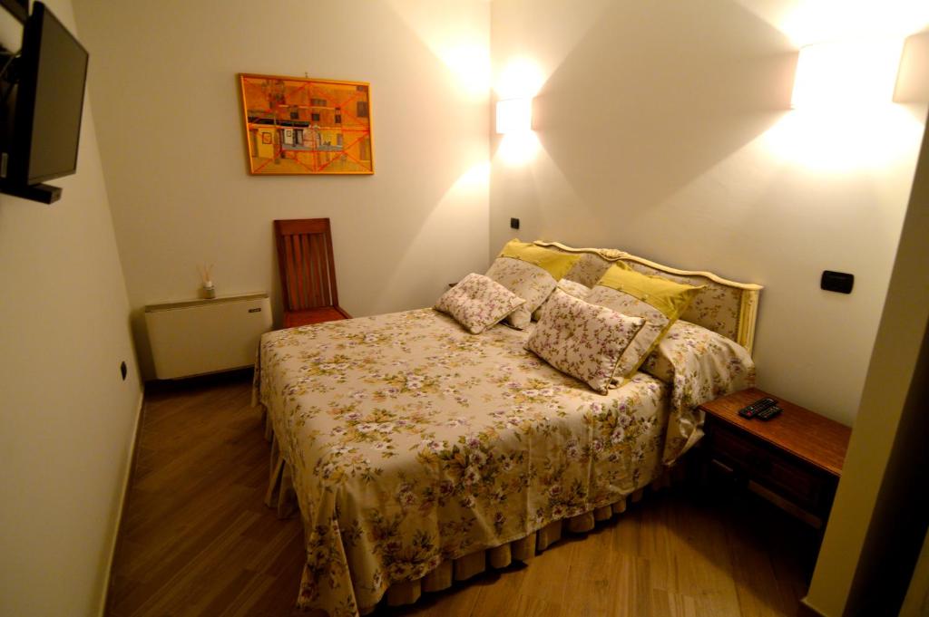 Postel nebo postele na pokoji v ubytování La Vignola Country Hotel