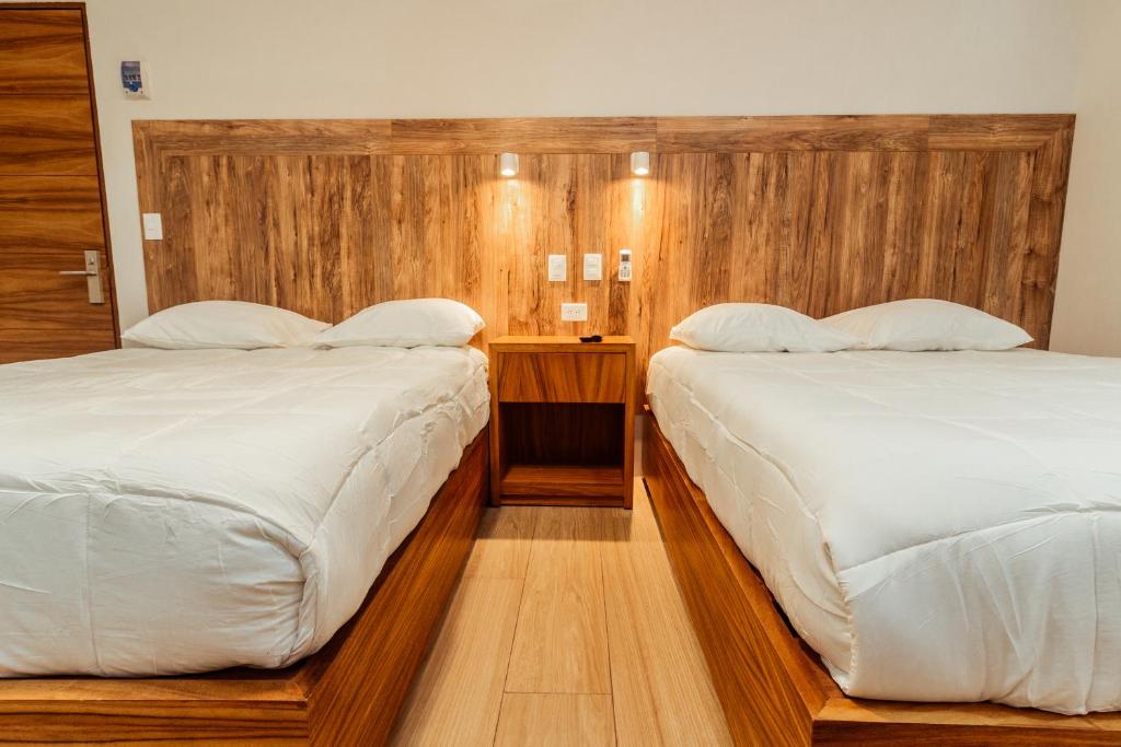Postel nebo postele na pokoji v ubytování Xoza Hotel Urban Escape