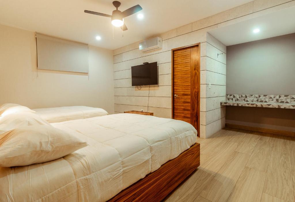 Postel nebo postele na pokoji v ubytování Xoza Hotel Urban Escape