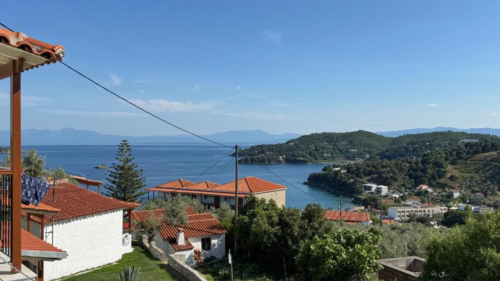 a view of a lake from a house at Valmas Village Apartments pool&bar in Skiathos
