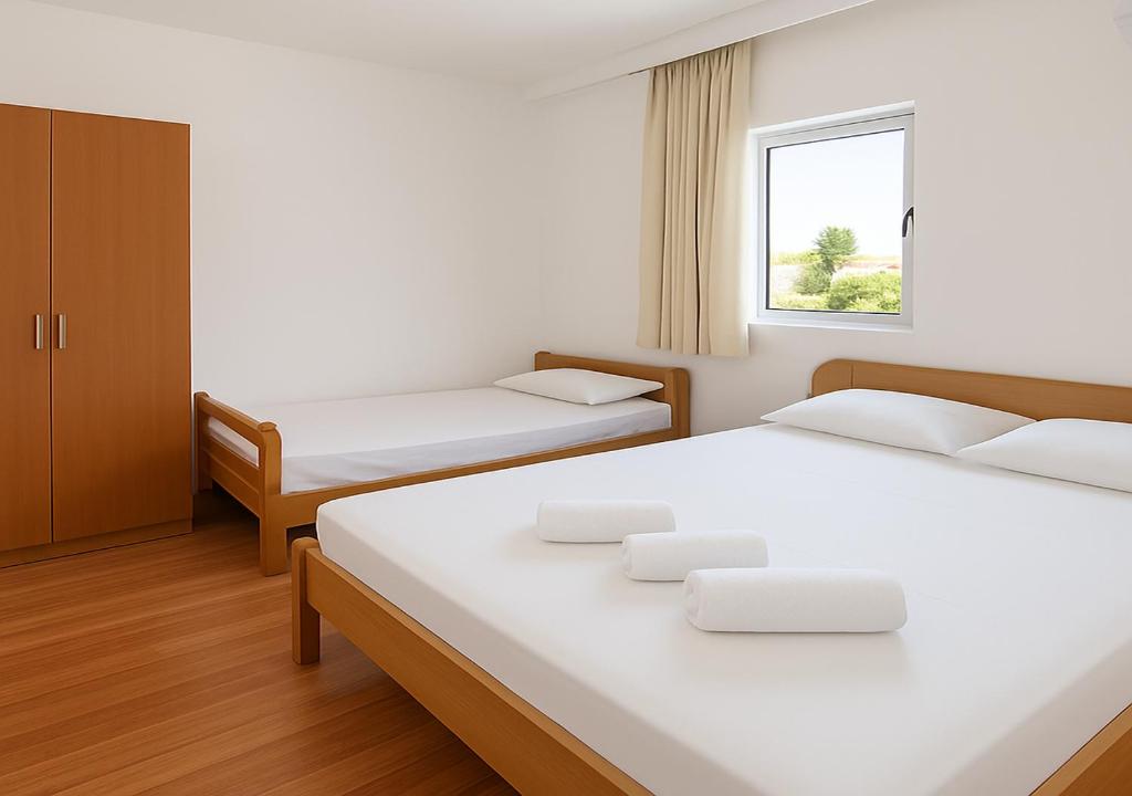 Postel nebo postele na pokoji v ubytování Apartments Hija