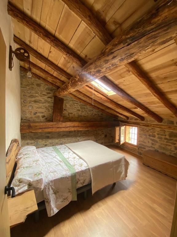 a bedroom with a bed in an attic at La Sabina in Terriente