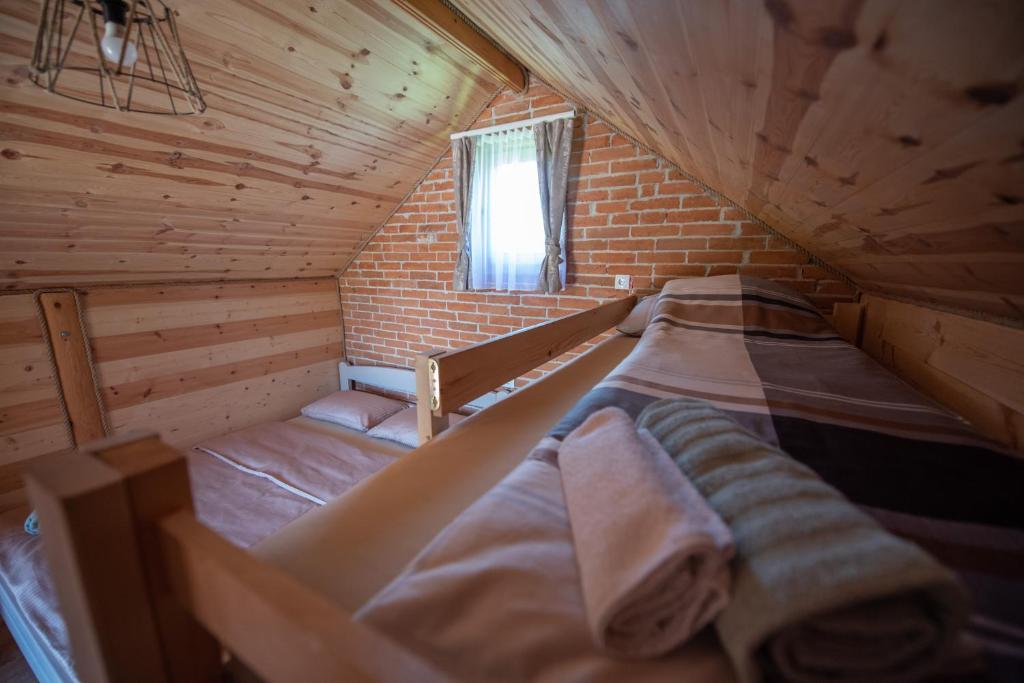 Postel nebo postele na pokoji v ubytování Camp Laksi