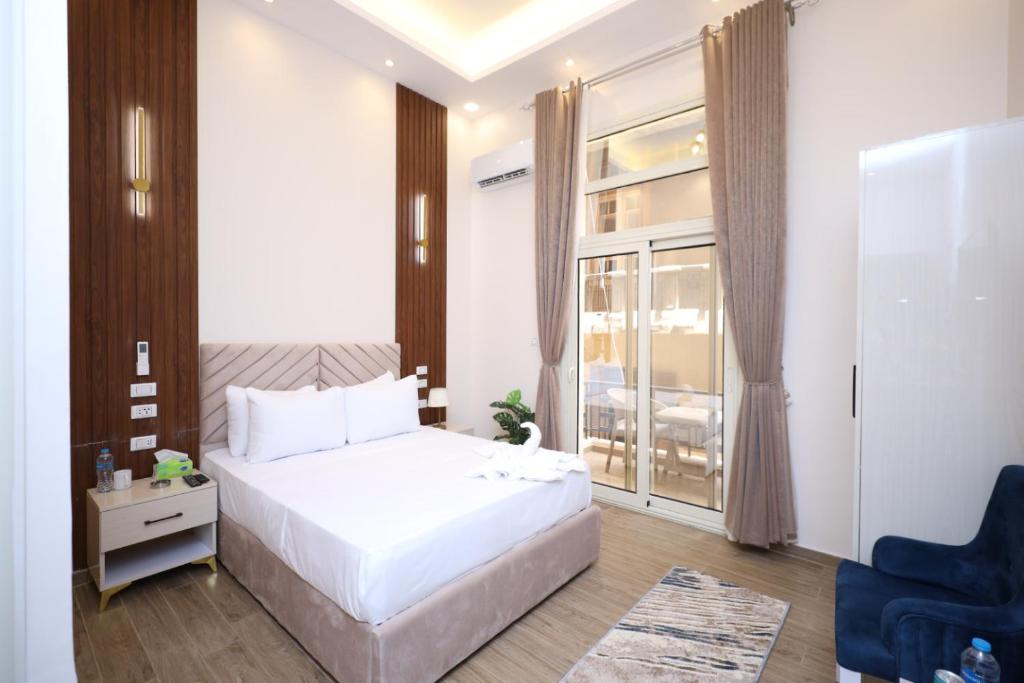 Postel nebo postele na pokoji v ubytování Aphrodite Boutique Hotel