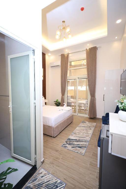 Postel nebo postele na pokoji v ubytování Aphrodite Boutique Hotel