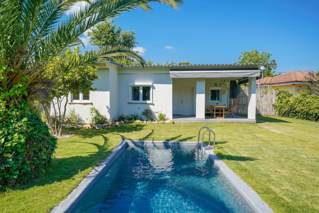 Bazén v ubytování Rafaelo Pool Side Villas nebo v jeho okolí