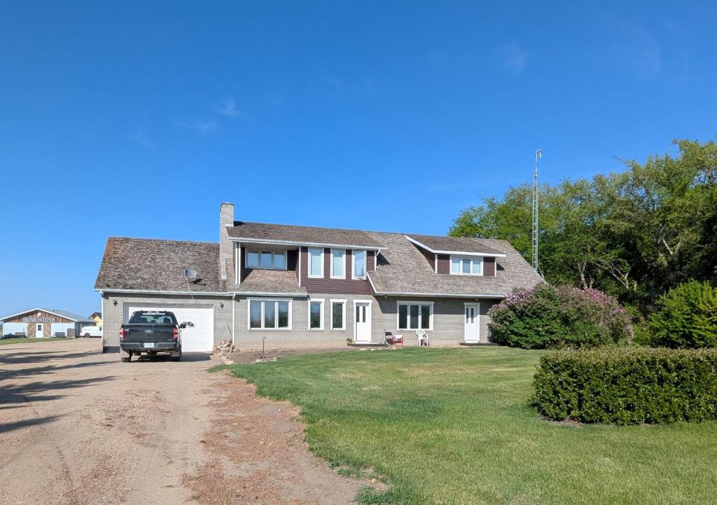 a house with a truck parked in the driveway at The Ranch Highway 55 in Debden