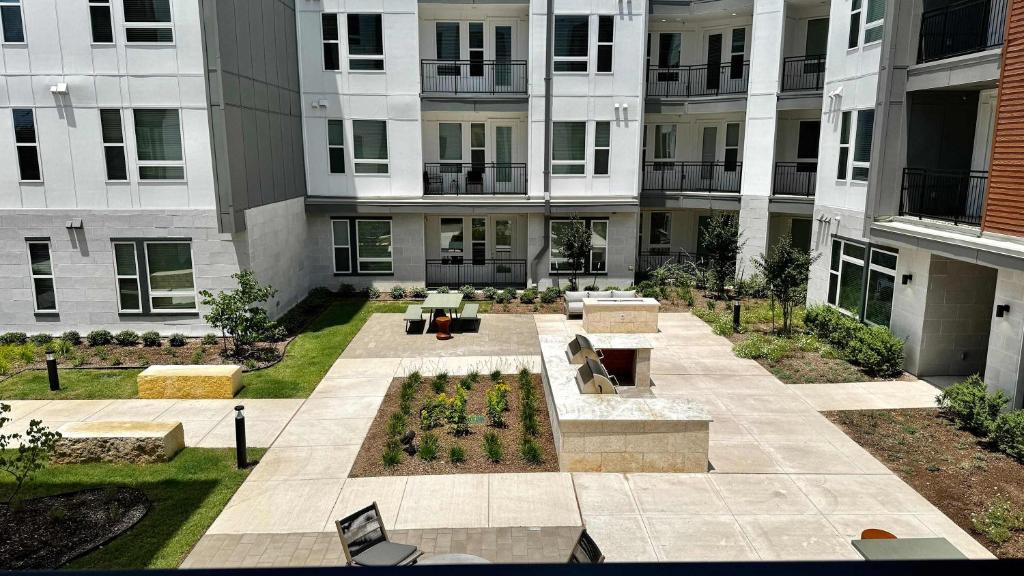 an aerial view of a courtyard in a building at Modern 2- Bed Apt Pool & Gym in Austin