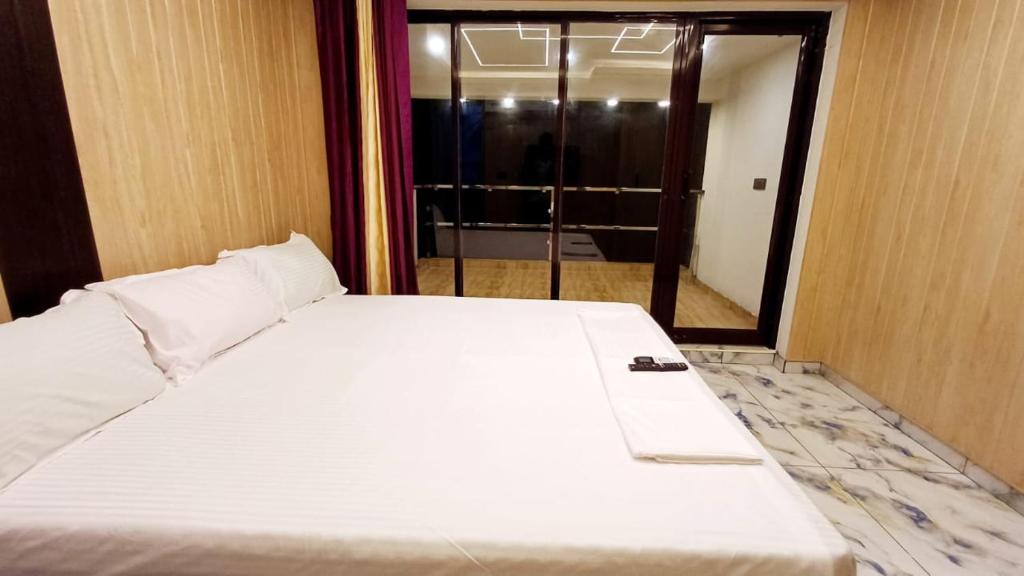 Voodi või voodid majutusasutuse Divine Beach Resorts toas
