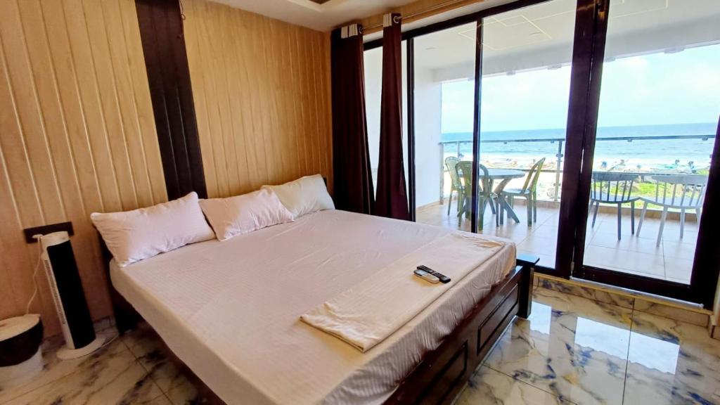 Voodi või voodid majutusasutuse Divine Beach Resorts toas