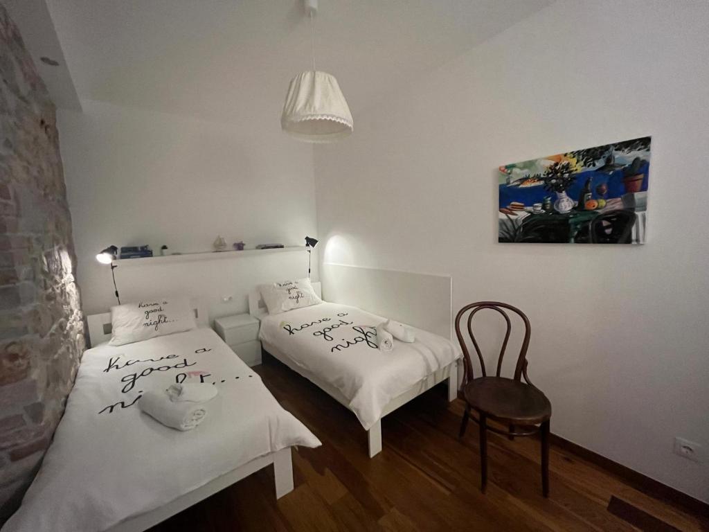 Postel nebo postele na pokoji v ubytování Karla