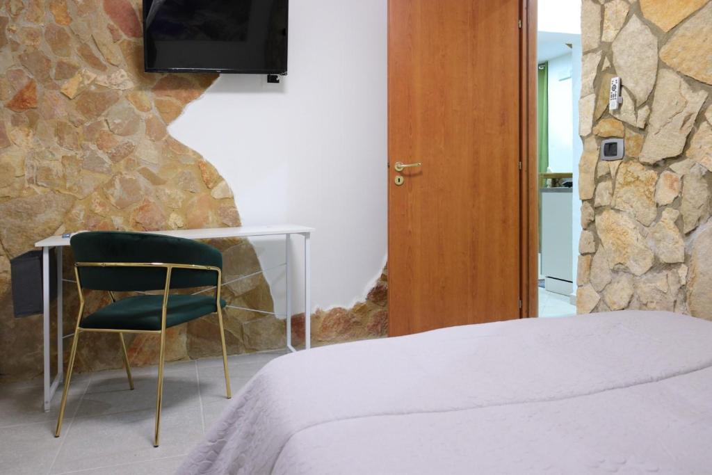 Postel nebo postele na pokoji v ubytování Pindaro