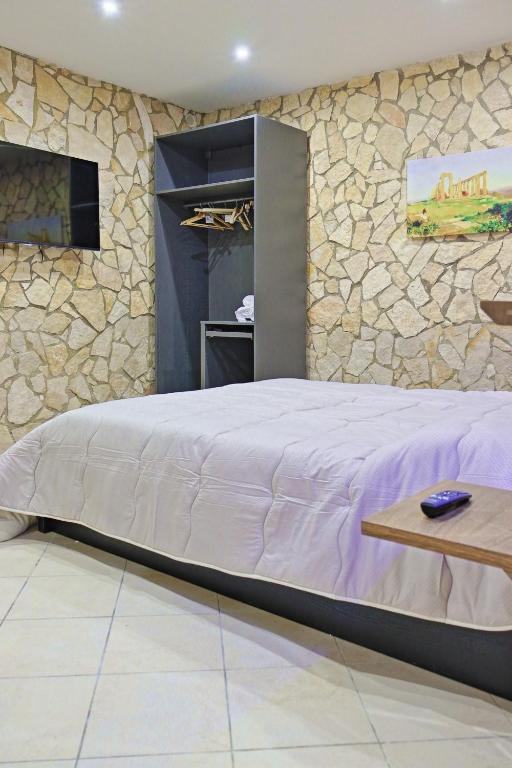Postel nebo postele na pokoji v ubytování Pindaro