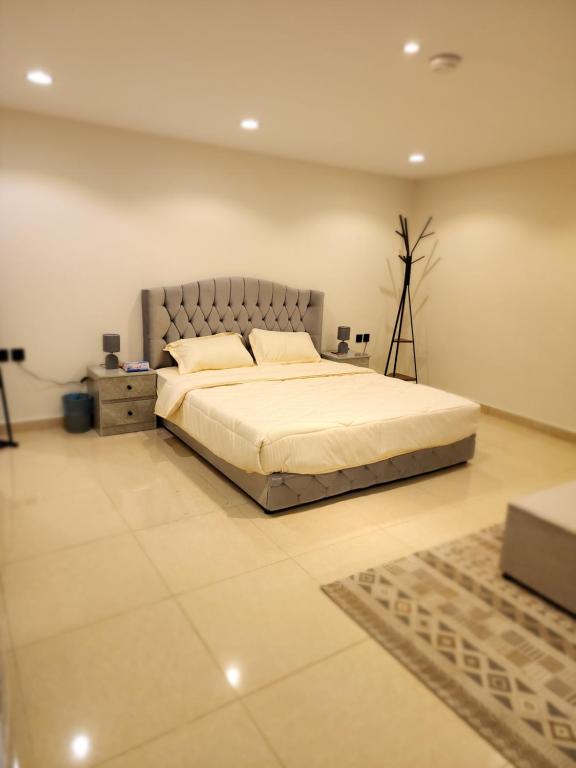 a bedroom with a large bed in a room at استوديو للايجار in Quai