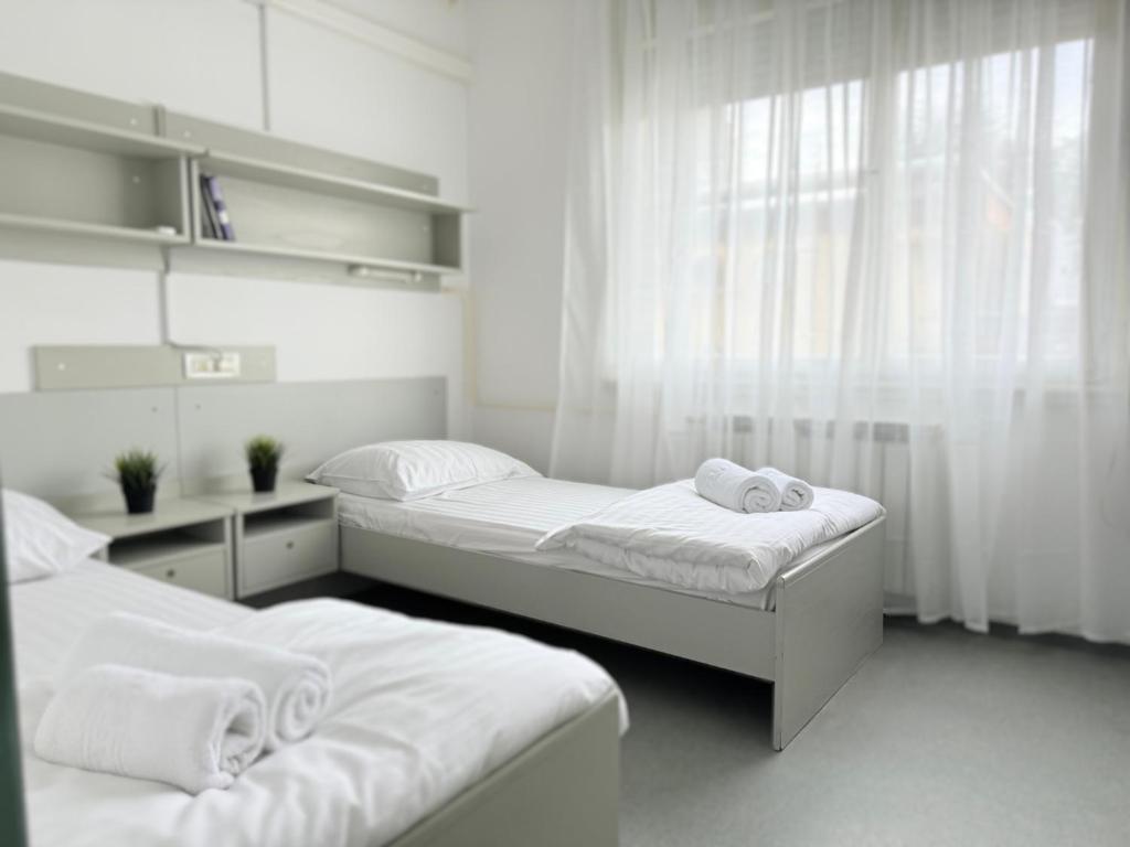 Postel nebo postele na pokoji v ubytování Hostel POINT