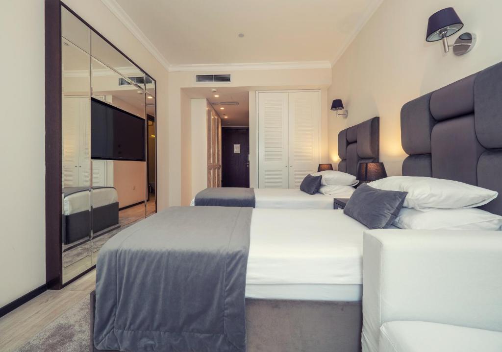 Postel nebo postele na pokoji v ubytování Hotel Moskva