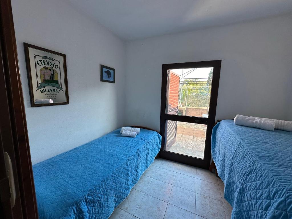 A bed or beds in a room at Appartamenti San Teodoro