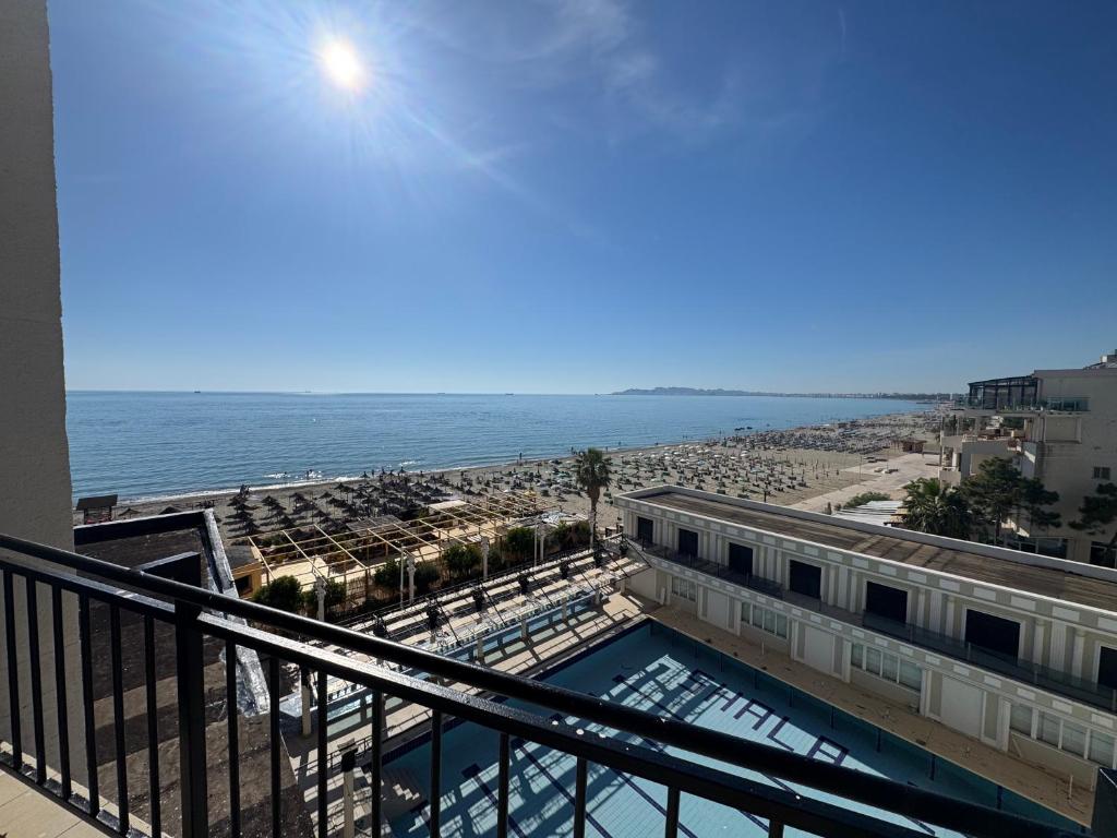 a view of the beach from the balcony of a resort at SunKissed Apartament in Golem