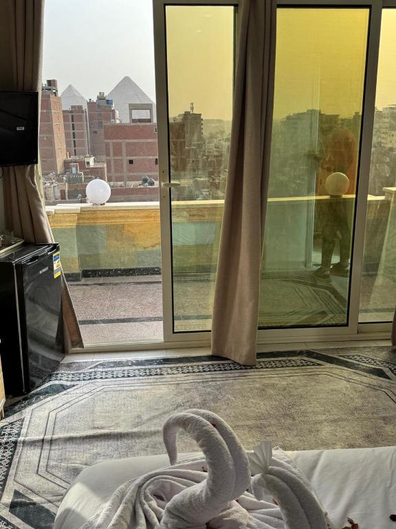 Postel nebo postele na pokoji v ubytování AL krma pyramids hotel