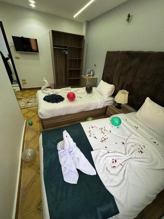 Postel nebo postele na pokoji v ubytování AL krma pyramids hotel