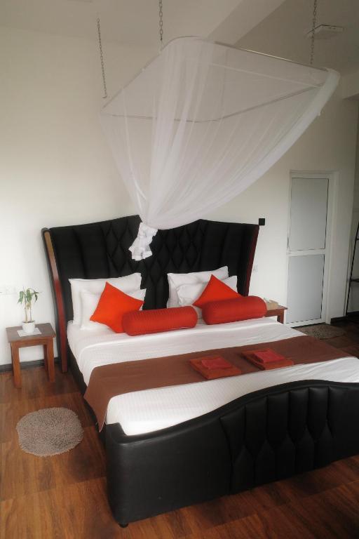 Postel nebo postele na pokoji v ubytování Will Guest Homestay