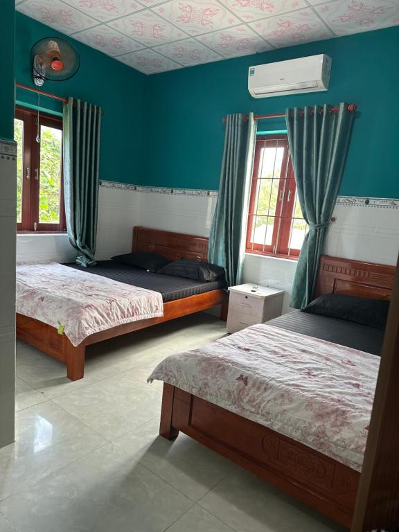Postel nebo postele na pokoji v ubytování San Vuon Guesthouse