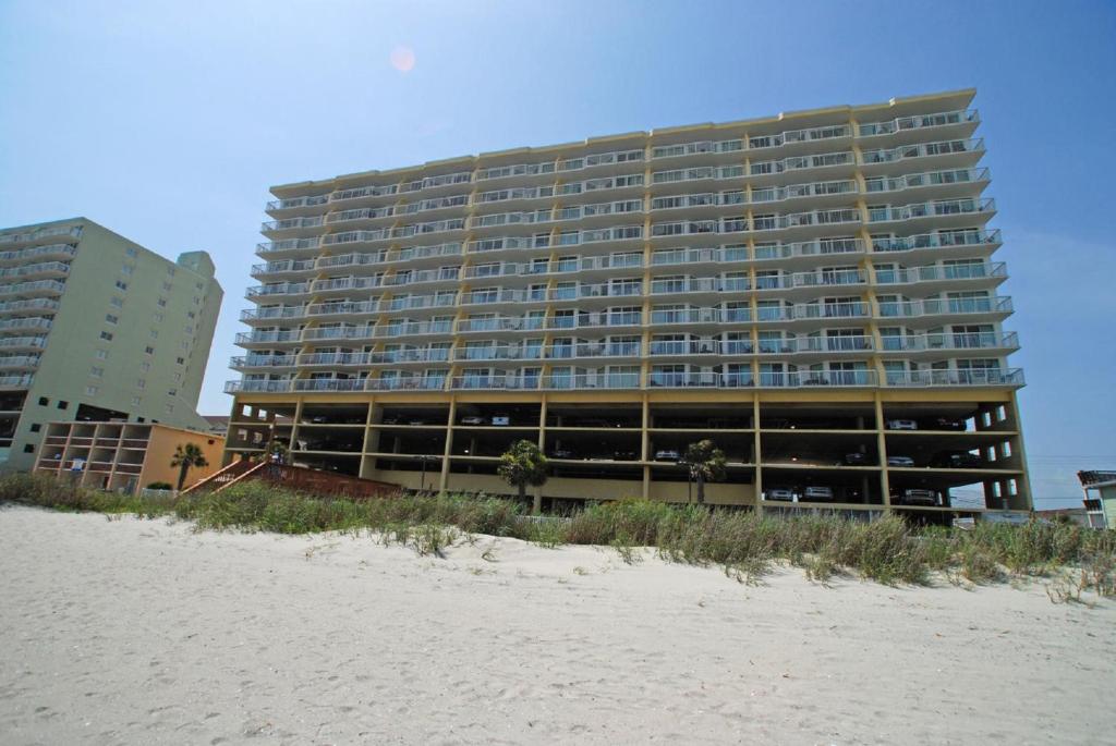 a large building on the beach next to the beach at Sunrise Pointe 11F Condo in Myrtle Beach