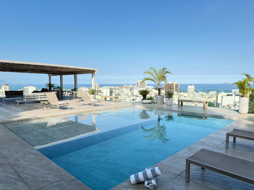 a swimming pool on the roof of a building at RARO Ipanema Boutique Hotel in Rio de Janeiro