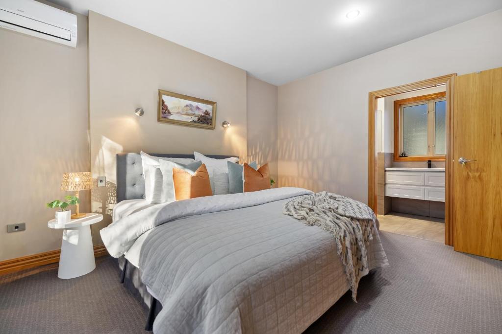 a bedroom with a large bed and a window at The Shan's Lodge in Queenstown