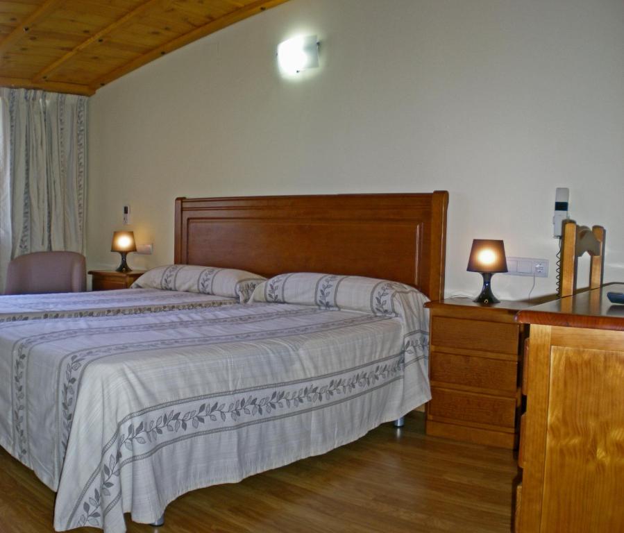 A bed or beds in a room at Labella María