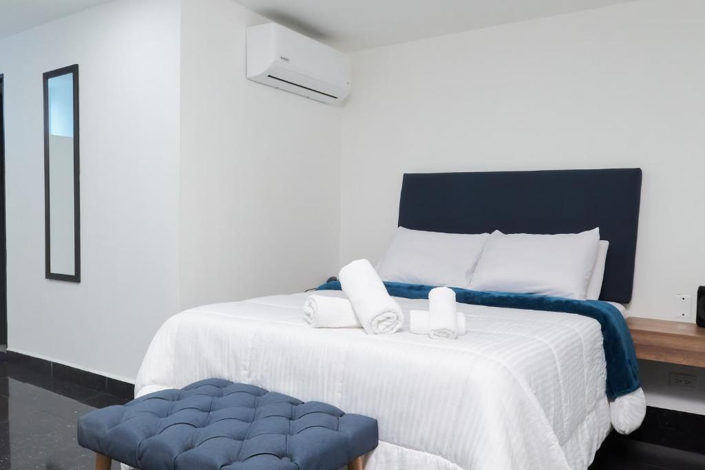 Postel nebo postele na pokoji v ubytování 33 HOTEL BOUTIQUE