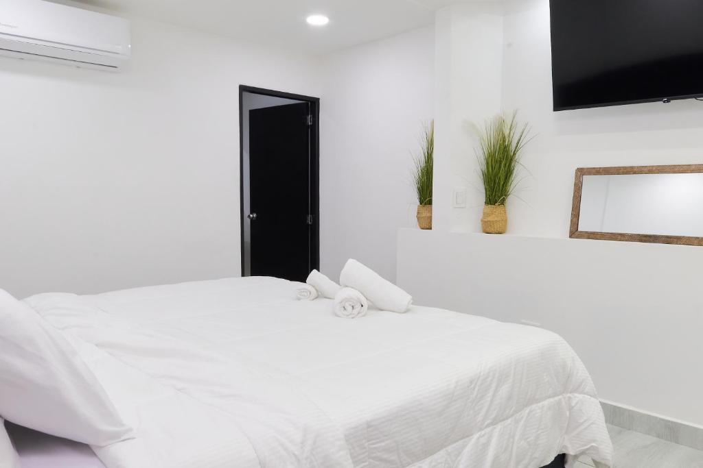 Postel nebo postele na pokoji v ubytování 33 HOTEL BOUTIQUE