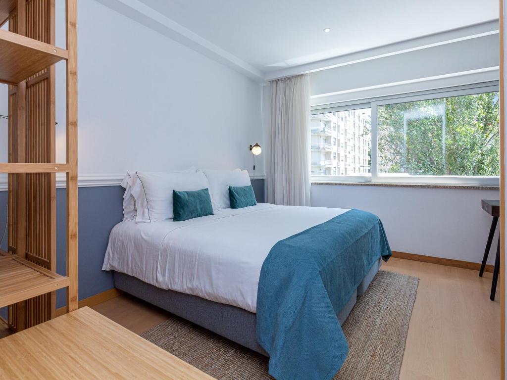 Postel nebo postele na pokoji v ubytování Feel Corporate Housing Marquês City View