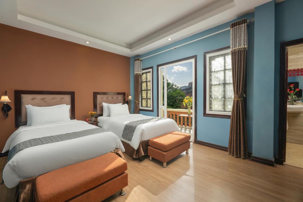 Giường trong phòng chung tại Sapa Fansipan View House