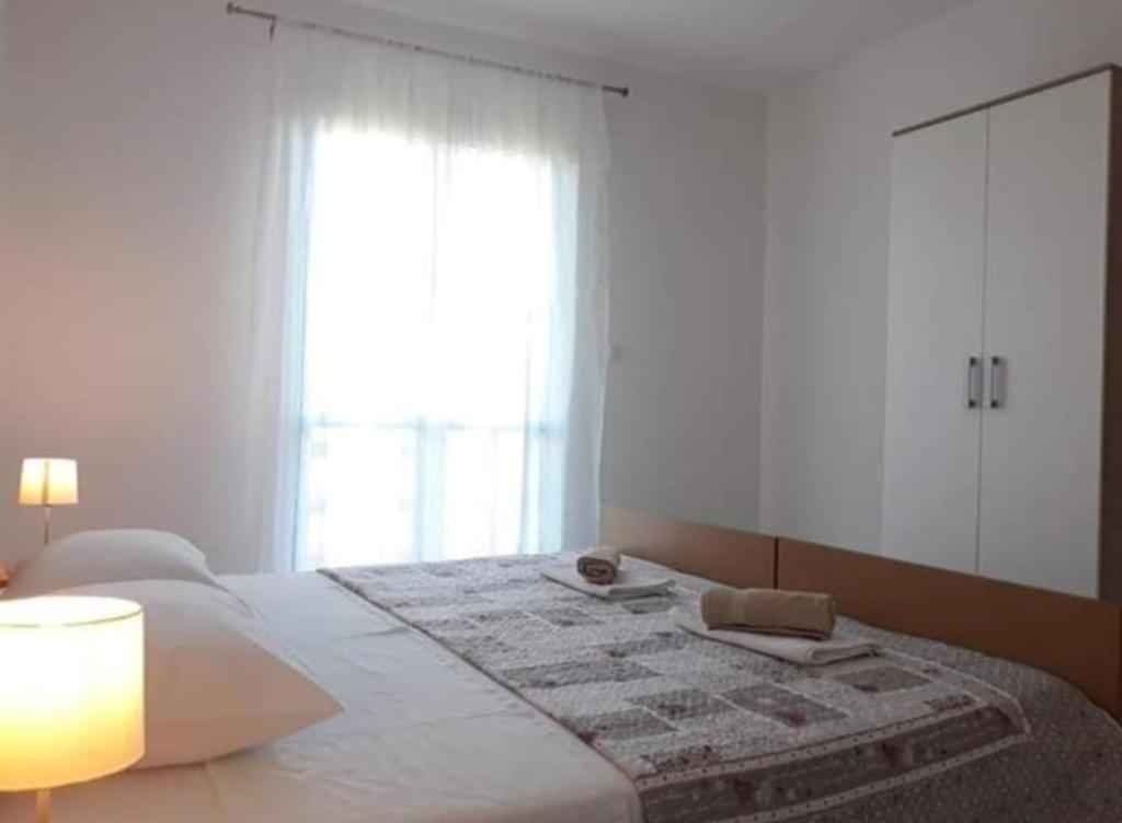 Łóżko lub łóżka w pokoju w obiekcie Apartments Jeličić