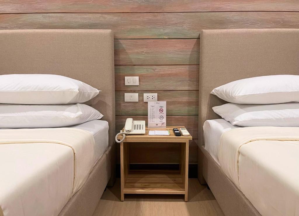 Postel nebo postele na pokoji v ubytování Sola Hotel