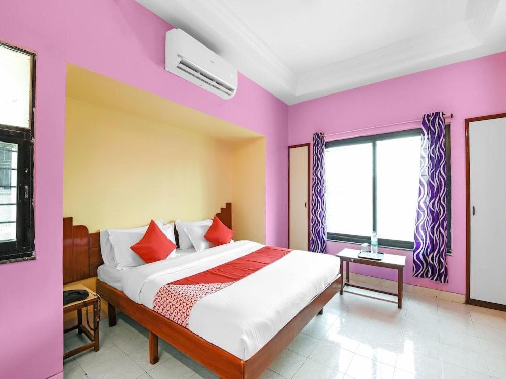 Katil atau katil-katil dalam bilik di Hotel Kalalaxmi lodging