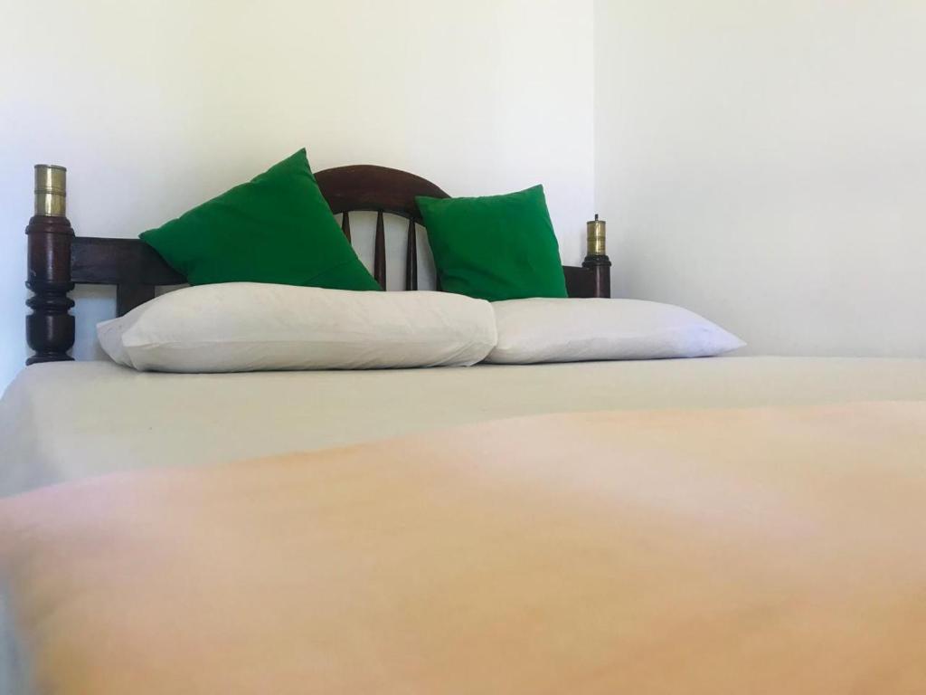 Postel nebo postele na pokoji v ubytování New Amadeo Beach
