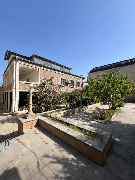 a building with a staircase in front of a building at La villa de Ramil in Baku