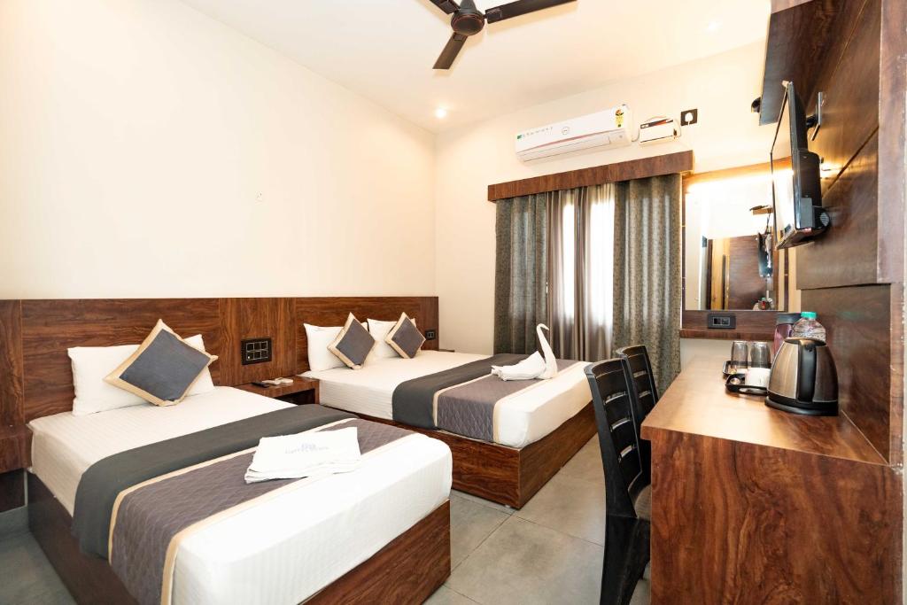 Postel nebo postele na pokoji v ubytování HOTEL ELITE