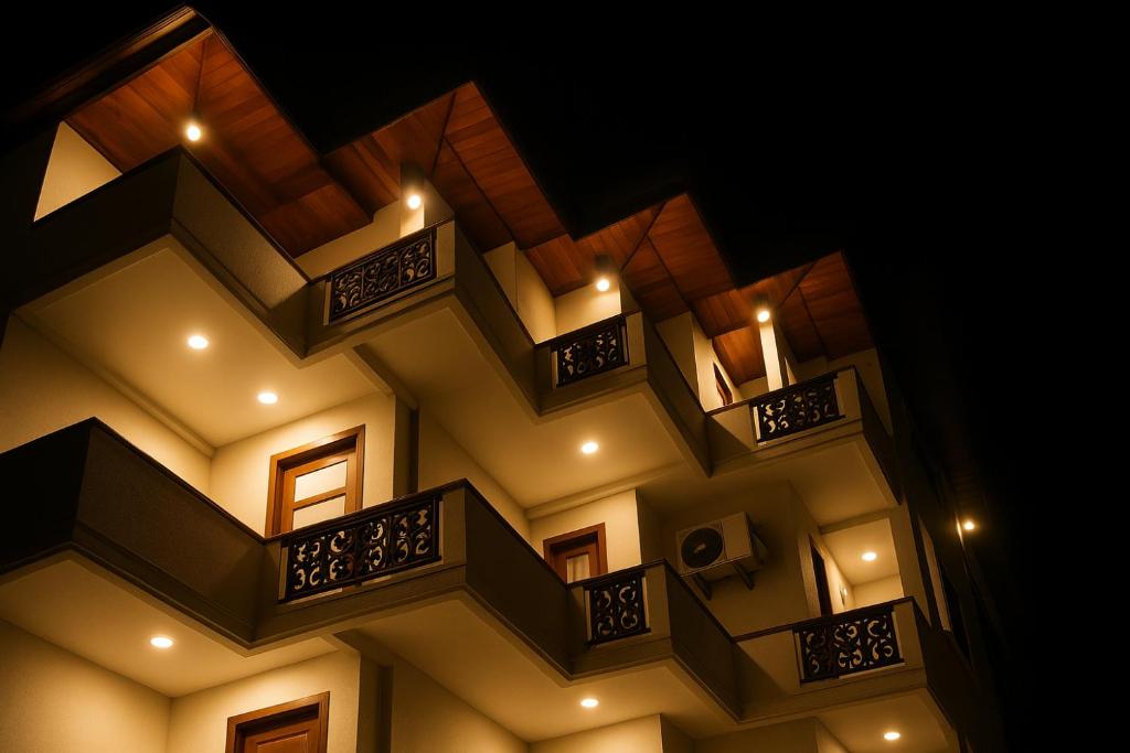 a building with balconies and lights on it at Ranaya Residence Kandy in Kandy