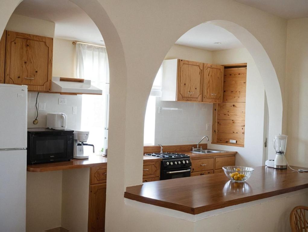 Kuchyň nebo kuchyňský kout v ubytování Zihua Mia Hotel Boutique