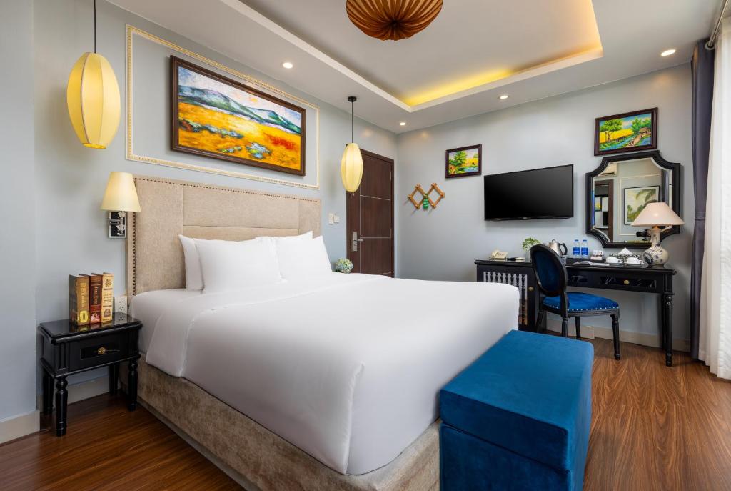 Postel nebo postele na pokoji v ubytování Golden Amour Hotel