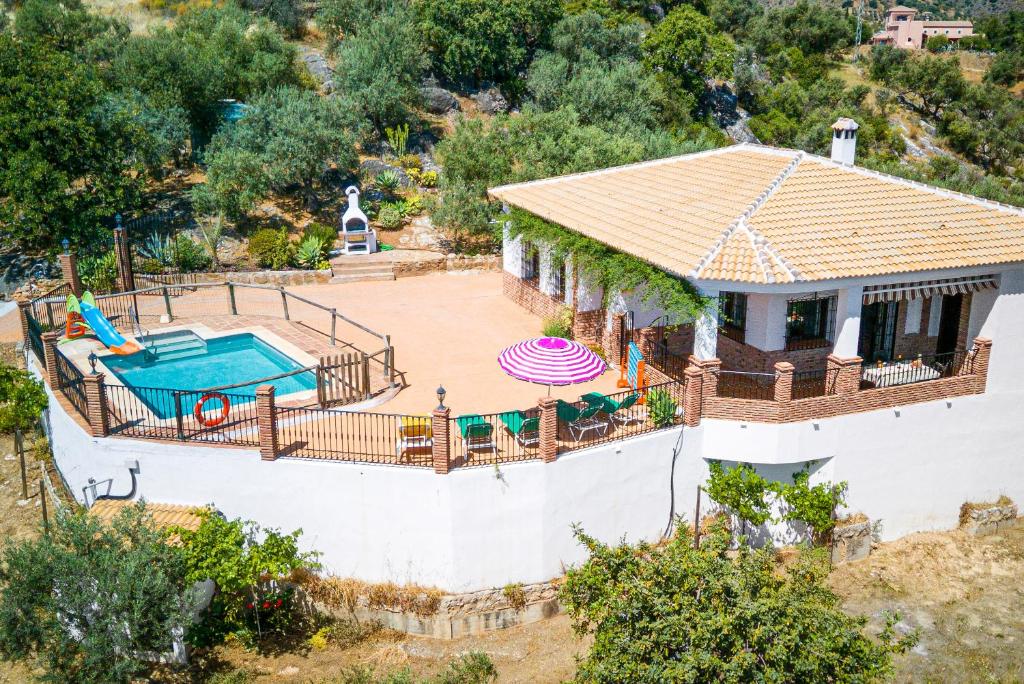an aerial view of a house with a swimming pool at El Mirador del Abuelo in Málaga