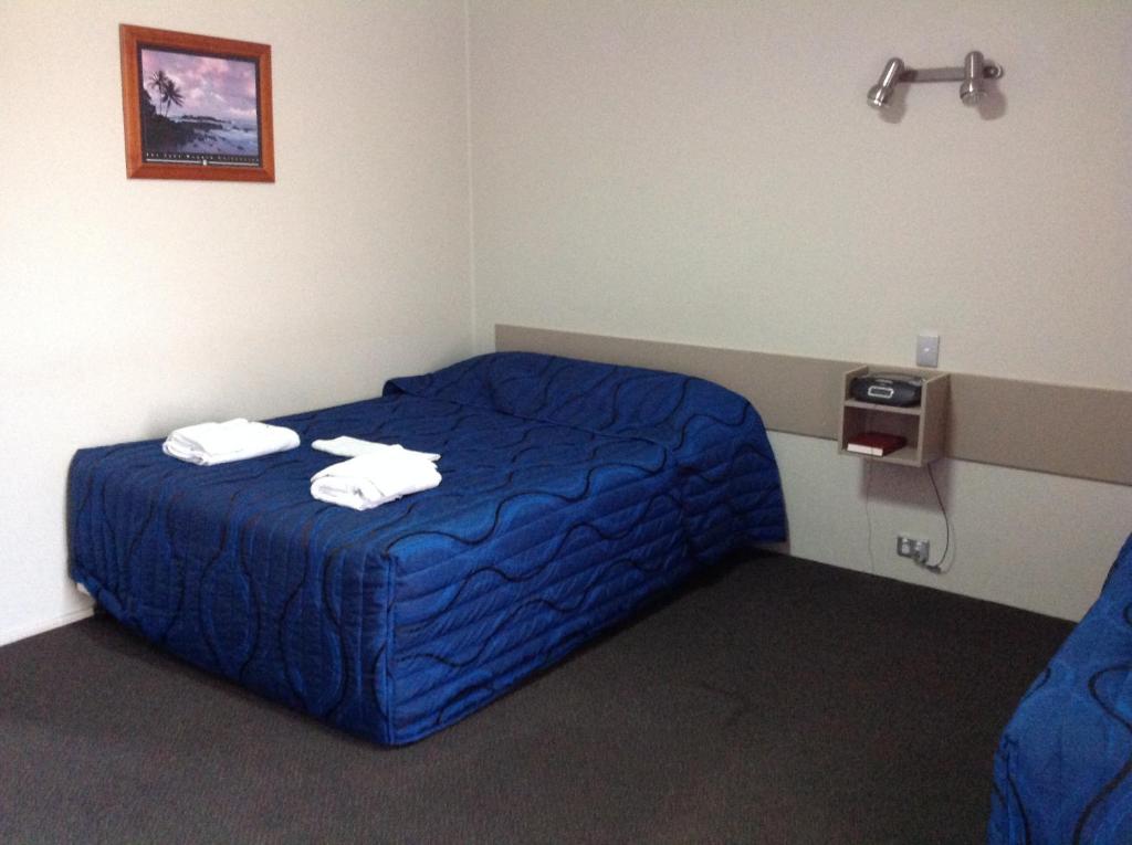 Postel nebo postele na pokoji v ubytování Tannum Sands Hotel / Motel